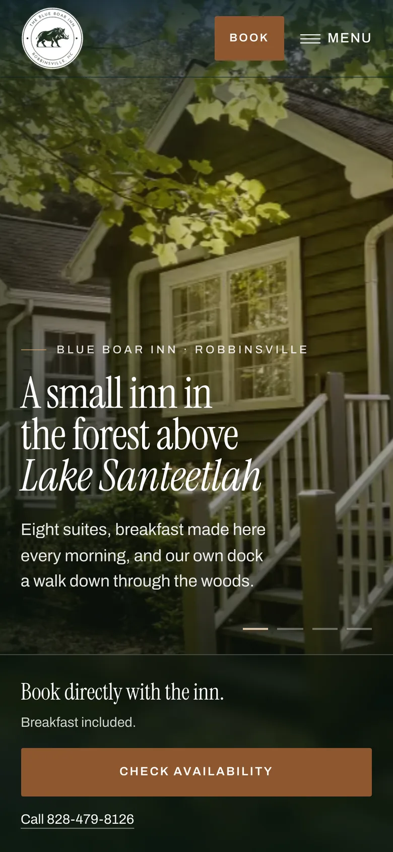 The rebuilt Blue Boar Inn homepage on a phone: the inn among the trees, the headline about the forest above Lake Santeetlah, and a booking button.