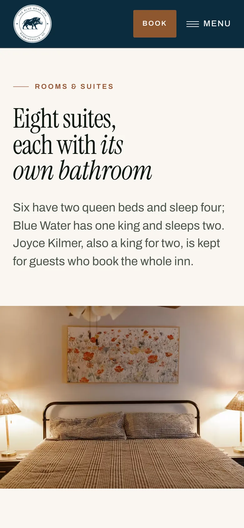 The Blue Boar Inn rooms page on a phone: the heading Eight suites, each with its own bathroom, and the first photographs of the rooms.