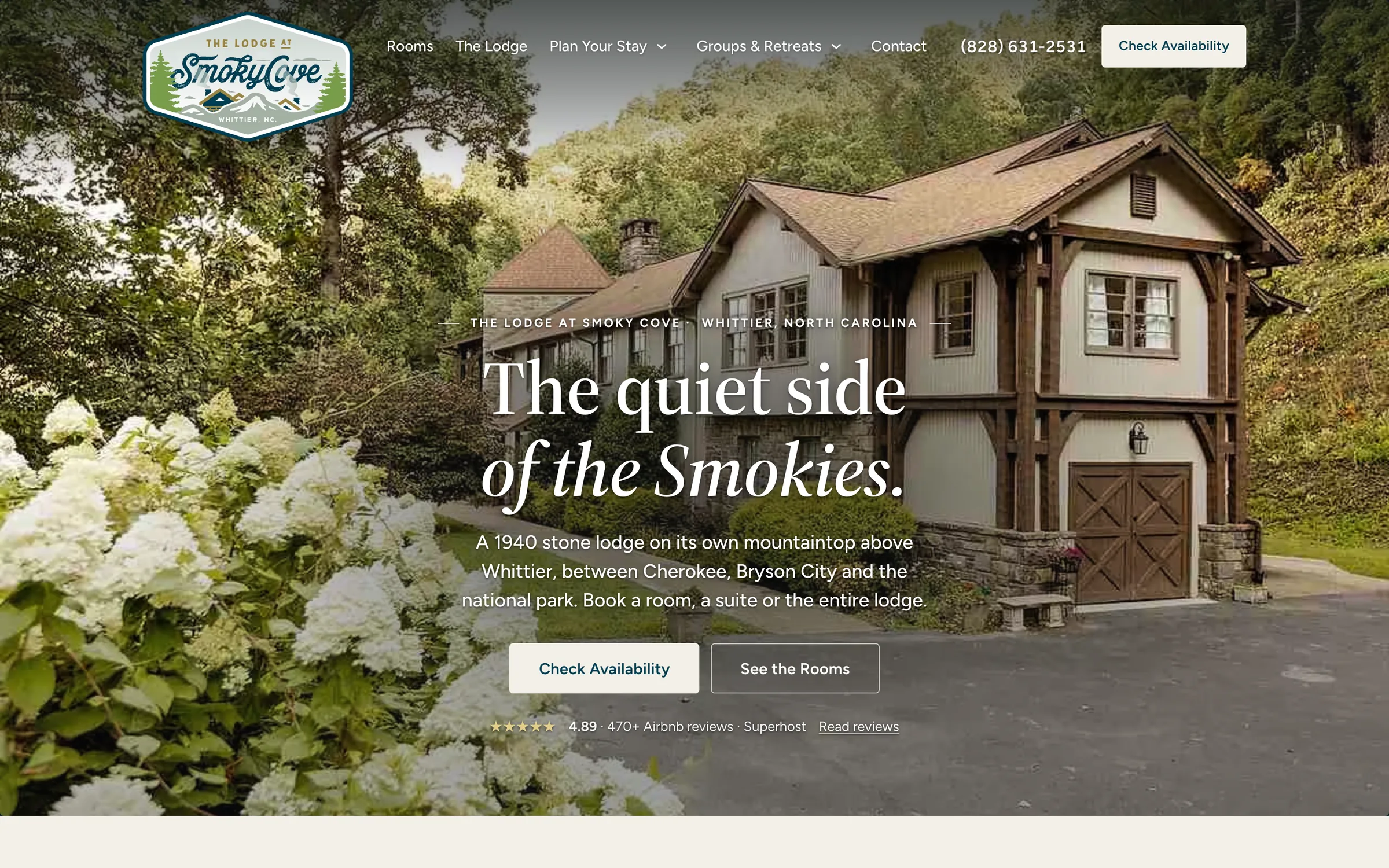 The rebuilt Smoky Cove Lodge homepage by Oogle: the stone and timber lodge among hydrangeas, the headline The quiet side of the Smokies, and Check Availability and See the Rooms buttons.